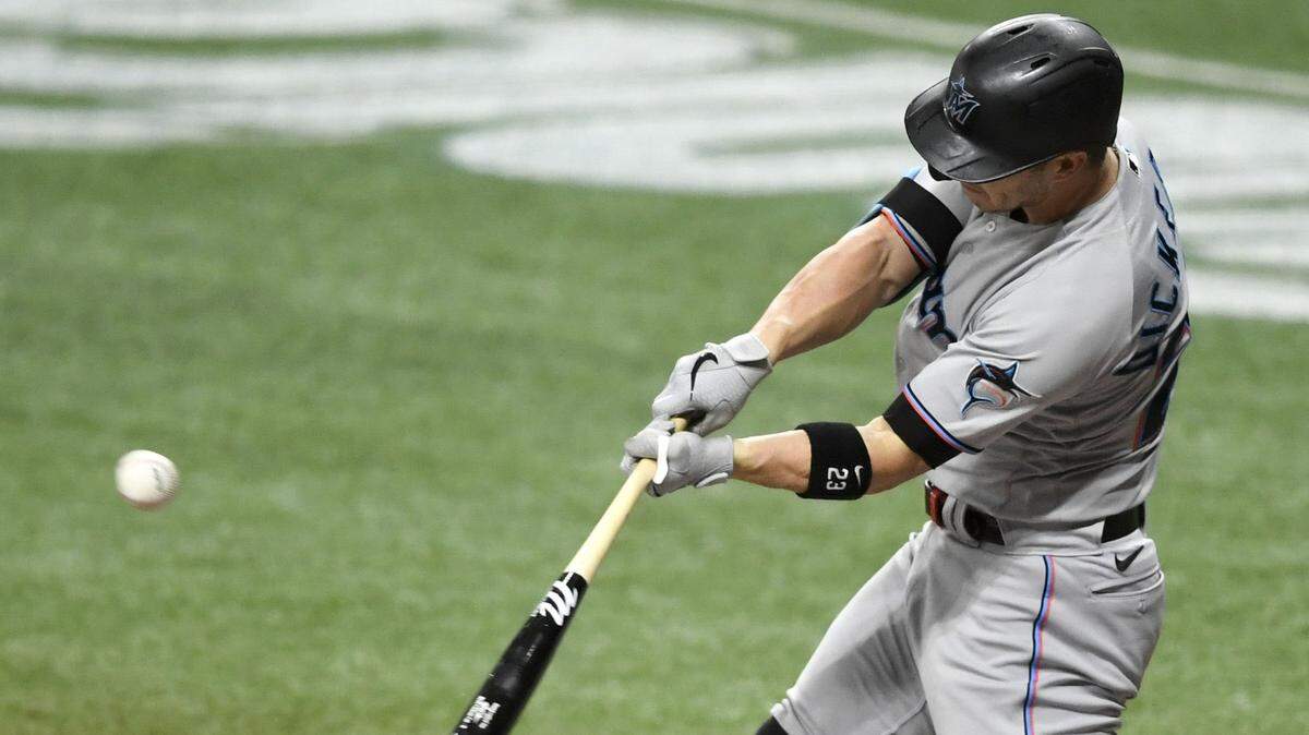 Corey Dickerson of the Miami Marlins hits a solo home run during the third inning against the Tampa Bay Rays at Tropicana Field in St. Petersburg, Florida, on Friday, Sept. 4, 2020. (Douglas P. DeFelice/Getty Images/TNS)