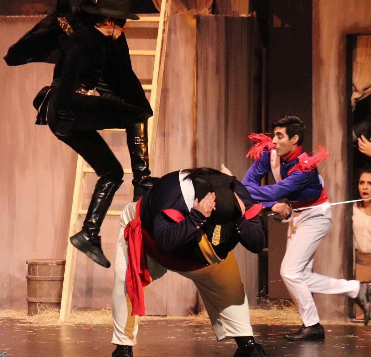 Lito Becerra’s Zorro takes a leap over Tommy Paduano’s Sergeant Garcia in “Zorro the Musical” at Miami Theater Center.