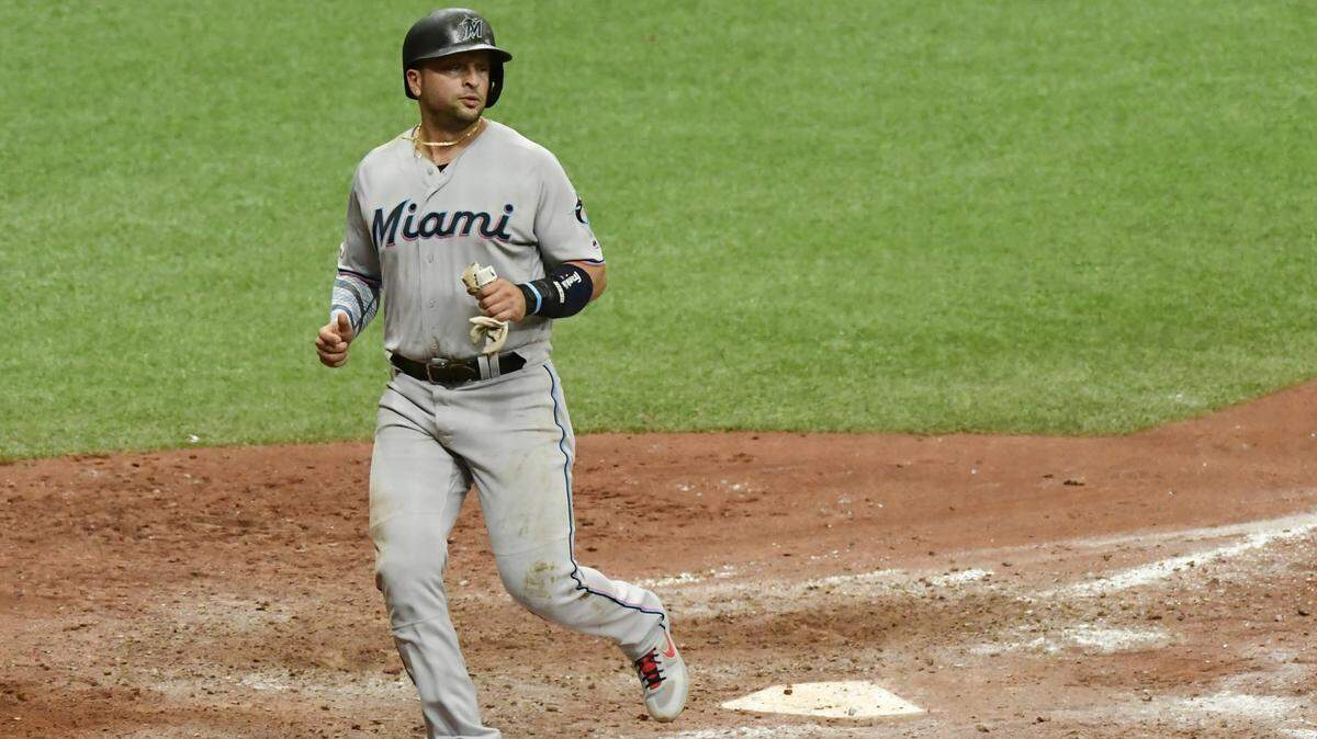 Martin Prado #14 of the Miami Marlins scores in the eighth inning of a baseball game against the Tampa Bay Rays at Tropicana Field on Aug. 04, 2019 in St. Petersburg, Florida. The Miami Marlins and Tampa Bay Rays engage in a Twitter fight during weekend series.