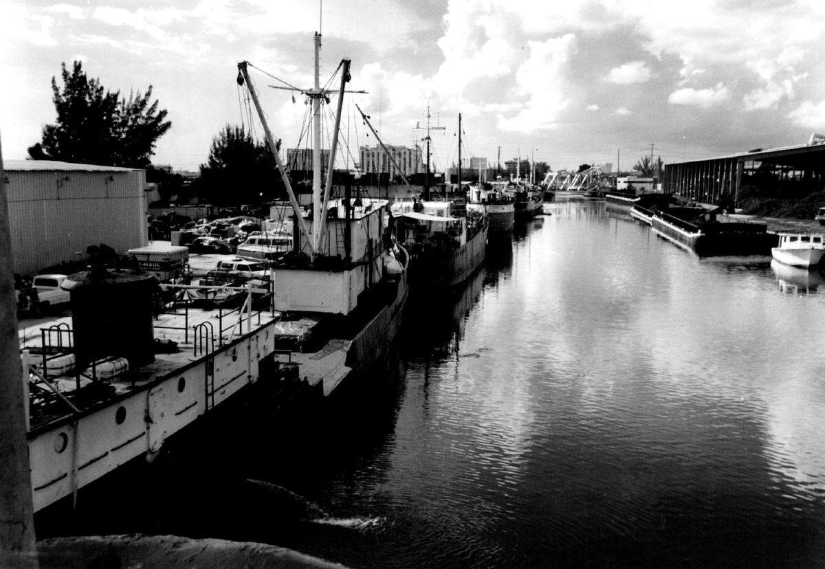 In 1991, these ships are loaded with goods on the Miami River and headed for Haiti.