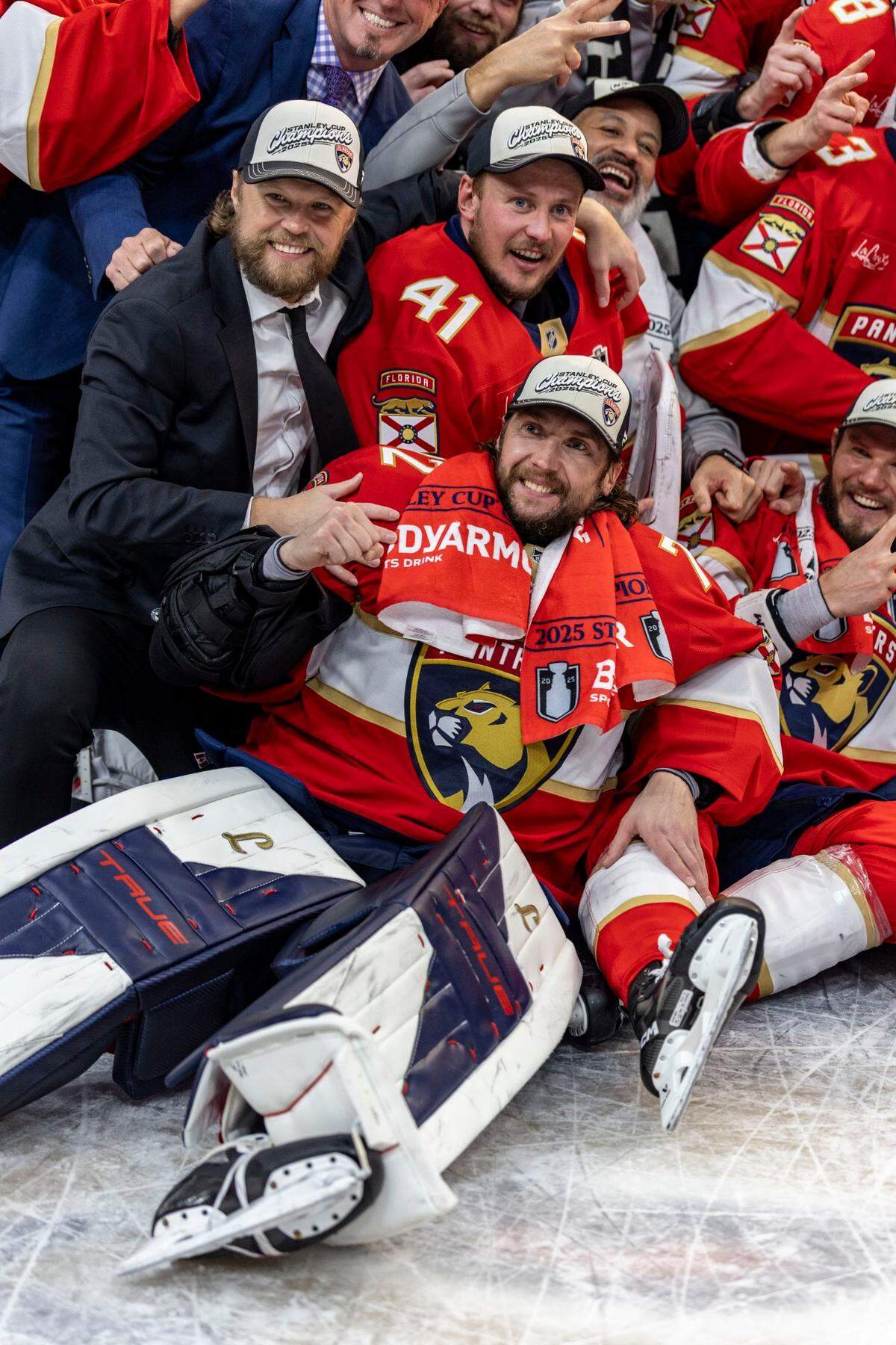 Florida Panthers goaltender Sergei Bobrovsky (72), bottom center, poses along with teammates, with the Stanley Cup after the Panthers defeated the Edmonton Oilers in Game 6 for their second consecutive Championship