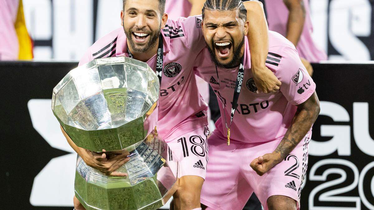 Inter Miami defenders Jordi Alba (18) and DeAndre Yedlin (2) celebrate after defeating Nashville SC in the Leagues Cup final at GEODIS Park on Saturday, Aug. 19, 2023, in Nashville, Tenn.