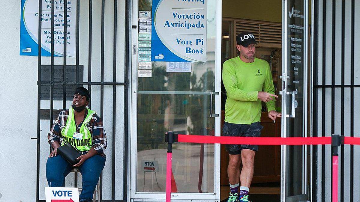 A voter exits the library after casting his ballot. On Monday, Oct. 24, 2022, some Miami residents cast their votes during the first day of early voting in Miami-Dade County at the Lemon City Library in Miami, Florida.