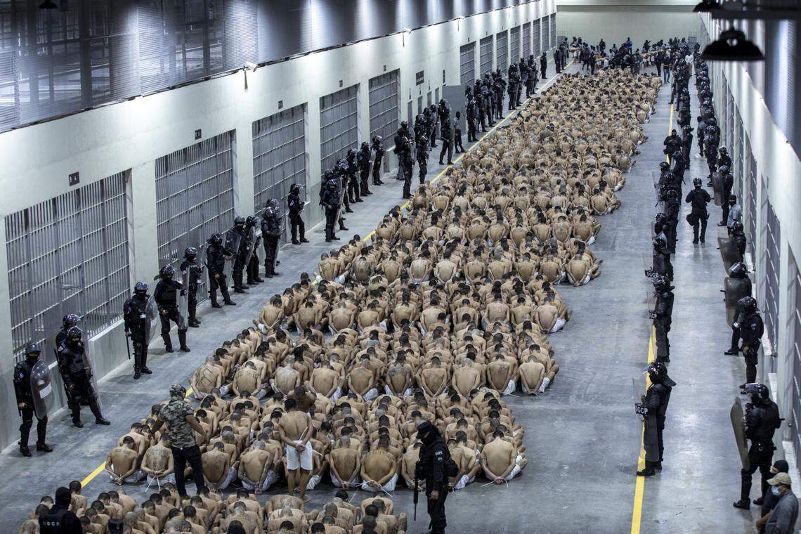 TECOLUCA, EL SALVADOR - MARCH 15: A second group of 2,000 detainees are moved to the mega-prison Terrorist Confinement Centre (CECOT)on March 15, 2023 in Tecoluca, El Salvador. Since president Bukele announced a state of exception in March 2022, over 62,000 suspected gang members have been arrested. Human Rights organizations denounce abuses and due process violations. El Salvador has one of highest crime rates in Latin America. A first group of detainees had been moved to the prison on February 26.