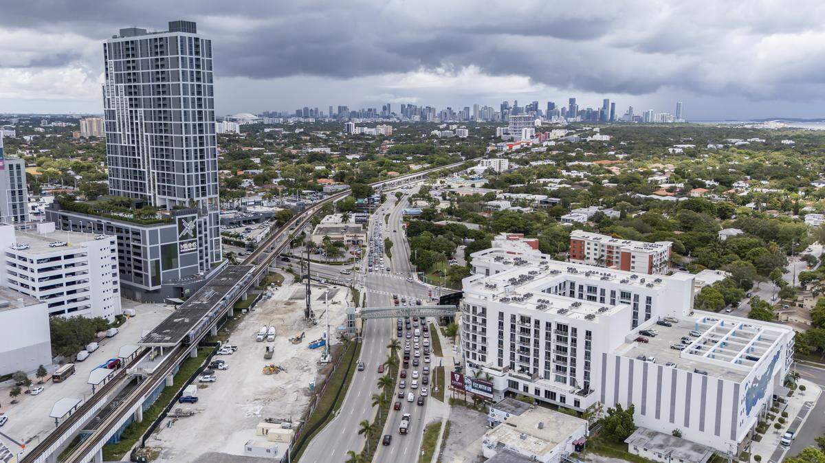 Aerial view of the Douglas Road Metrorail station on Thursday, Aug. 7, 2025, in Miami. City of Miami officials recently approved the Transit Station Neighborhood Development program, which will allow for increased development and affordable housing within a mile of each station.