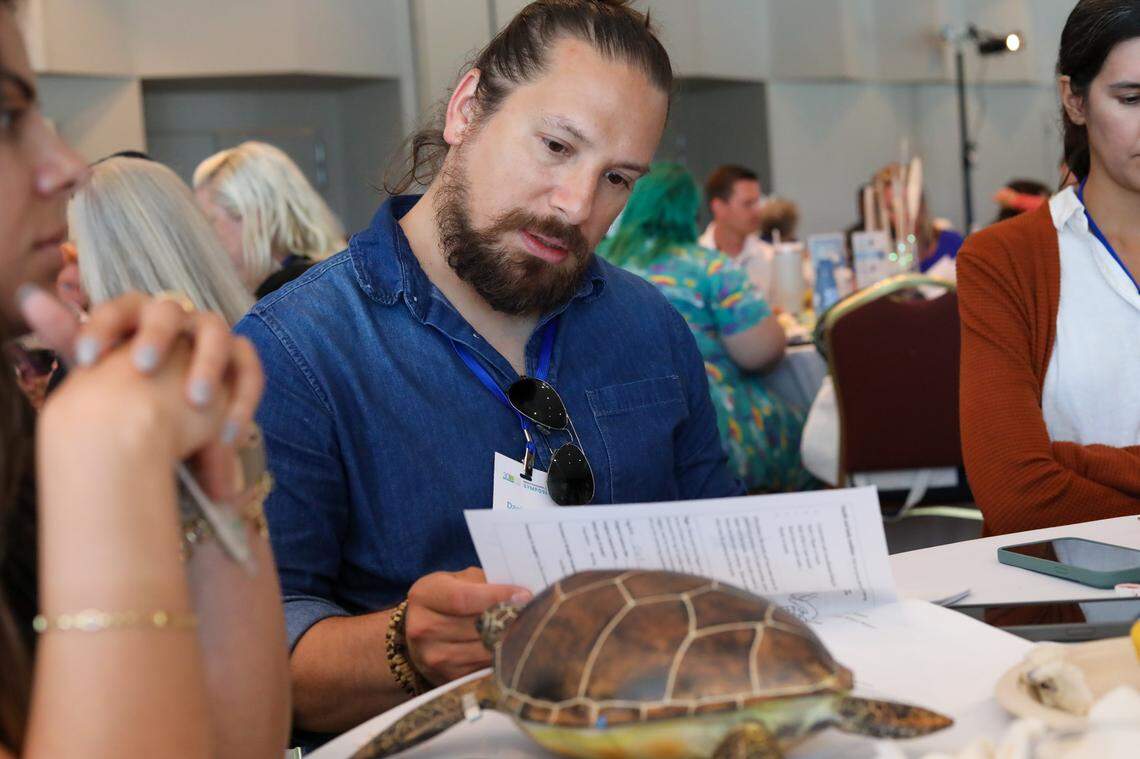 Daniel Valle reads a worksheet about sea turtle biology at the Everglades Foundation teacher symposium.