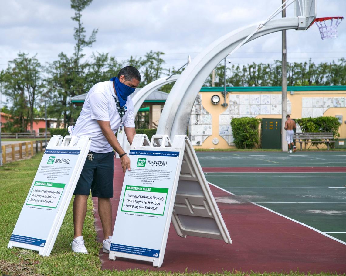 Signs display rules for using the basketball courts at Tropical Park. Miami-Dade County lifted its park closure orders due to COVID-19 on April 29, 2020.