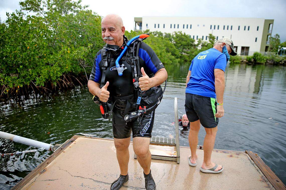 Military veteran Richard Perez gives the thumbs up after a WAVES diving instruction session at the College of the Florida Keys in Key West, Florida, Thursday, Oct. 22, 2020. The WAVES Project helps veterans heal from PTSD and other injuries through scuba diving.