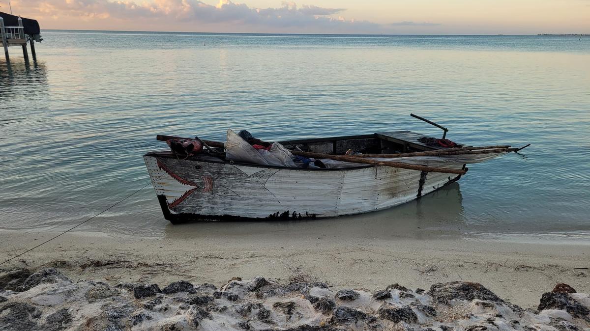 A migrant vessel is beached on the shore of the Florida Keys Thursday, Dec. 8, 2022. It was one of four boats that arrived on the island chain that day, carrying a total of 80 people from Cuba, according to the Border Patrol.