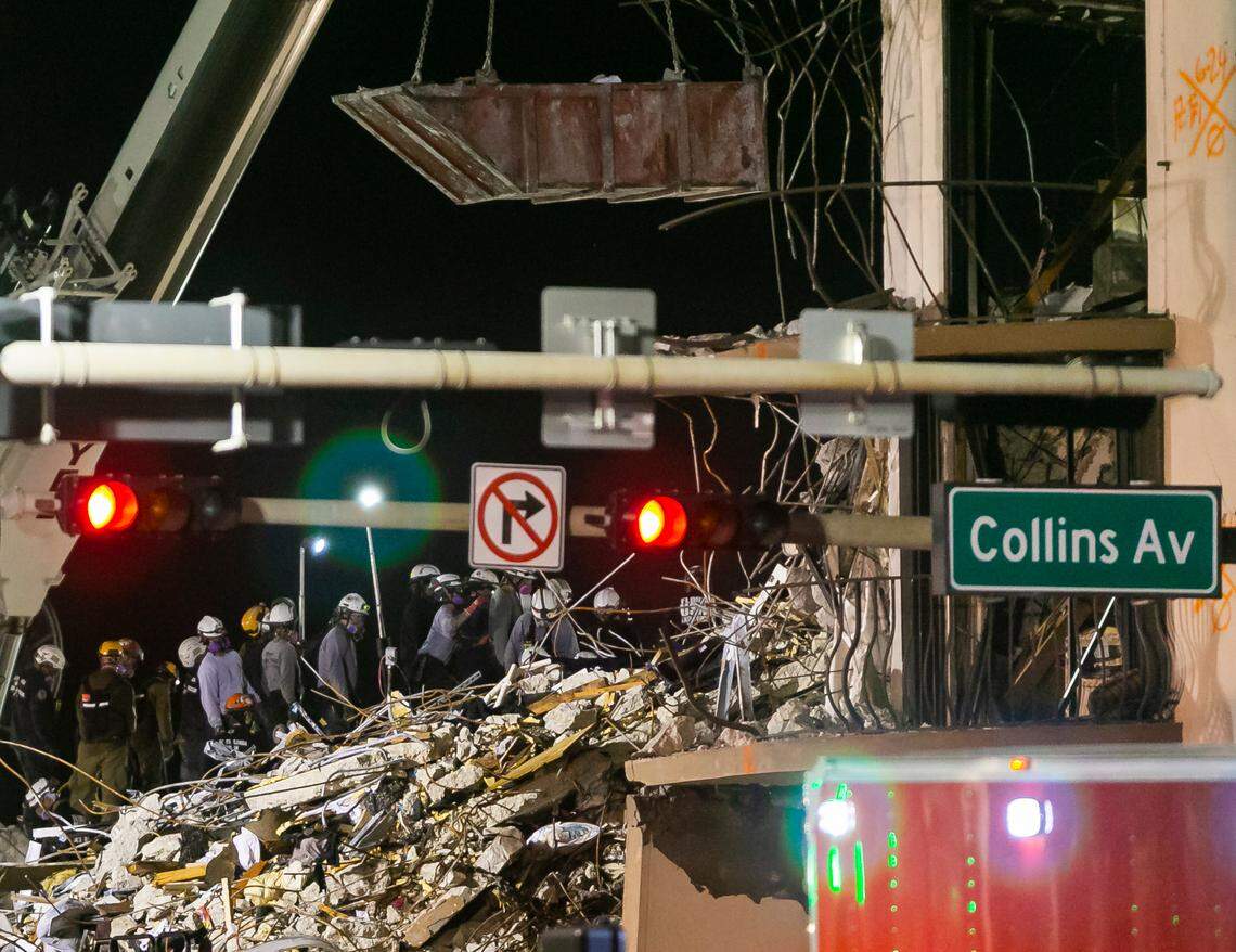 South Florida Urban Search and Rescue team looks through rubble for survivors at the partially collapsed Champlain Towers South condo building in Surfside, Florida, on Wednesday, June 30, 2021.