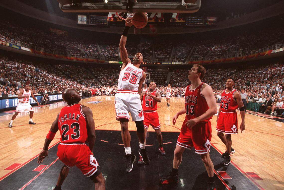 FILE PHOTO- Michael Jordan, Dennis Rodman, Luc Longley, and Scottie Pippen are frozen in time as Alonzo Mourning slams two points during first quarter action. This was not the game where the undermanned Heat squad beat the Bulls.