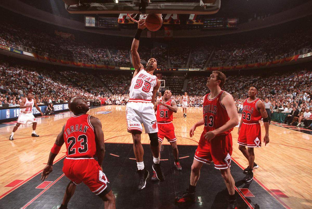 FILE PHOTO- Michael Jordan, Dennis Rodman, Luc Longley, and Scottie Pippen are frozen in time as Alonzo Mourning slams two points during first quarter action. This was not the game where the undermanned Heat squad beat the Bulls.