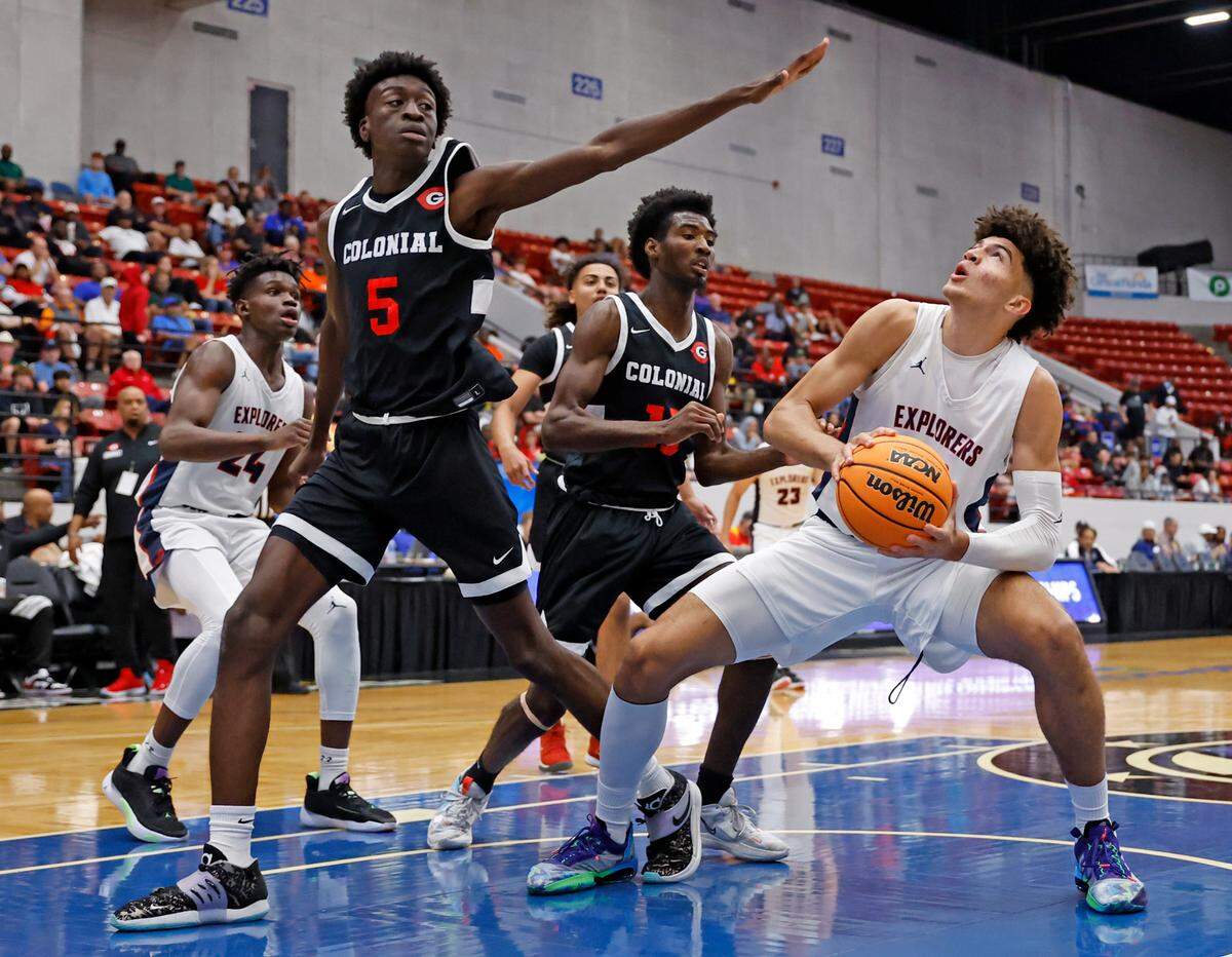 Columbus Explorers Cameron Boozer (12) as Colonial High School Emmanuel Rislin (5) defends in the first quarter during the FHSAA semifinal at the RP Funding Center in Lakeland, Florida on Friday, March 3, 2023.