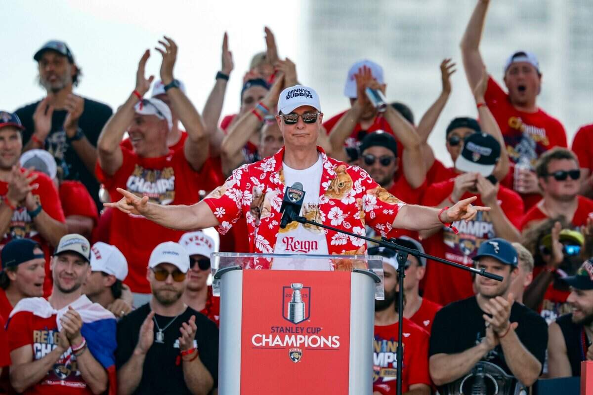 Florida Panthers head coach Paul Maurice addresses the crowd as players celebrate on stage during the team’s Stanley Cup victory parade and rally along A1A in Fort Lauderdale, Florida, on Sunday, June 22, 2025