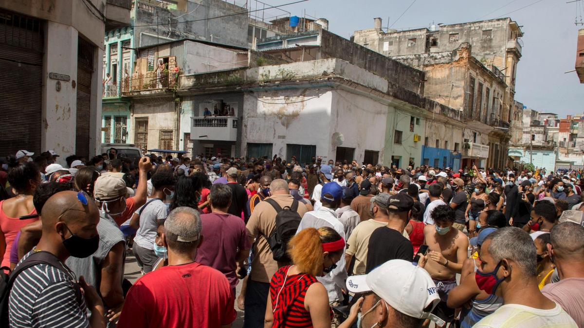 Anti-government demonstrators march in Havana, Cuba, on July 11, 2021 to protest against food shortages and high prices.