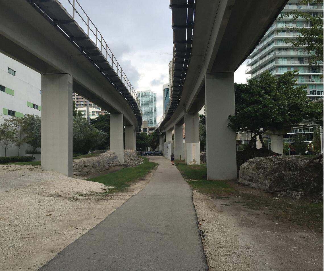 The path beneath the elevated Metrorail tracks as it appears today. This segment, running through exposed oolite rocks in Miami’s Brickell district, will be converted into a garden for the Underline trail and park plan that breaks ground Nov. 1.
