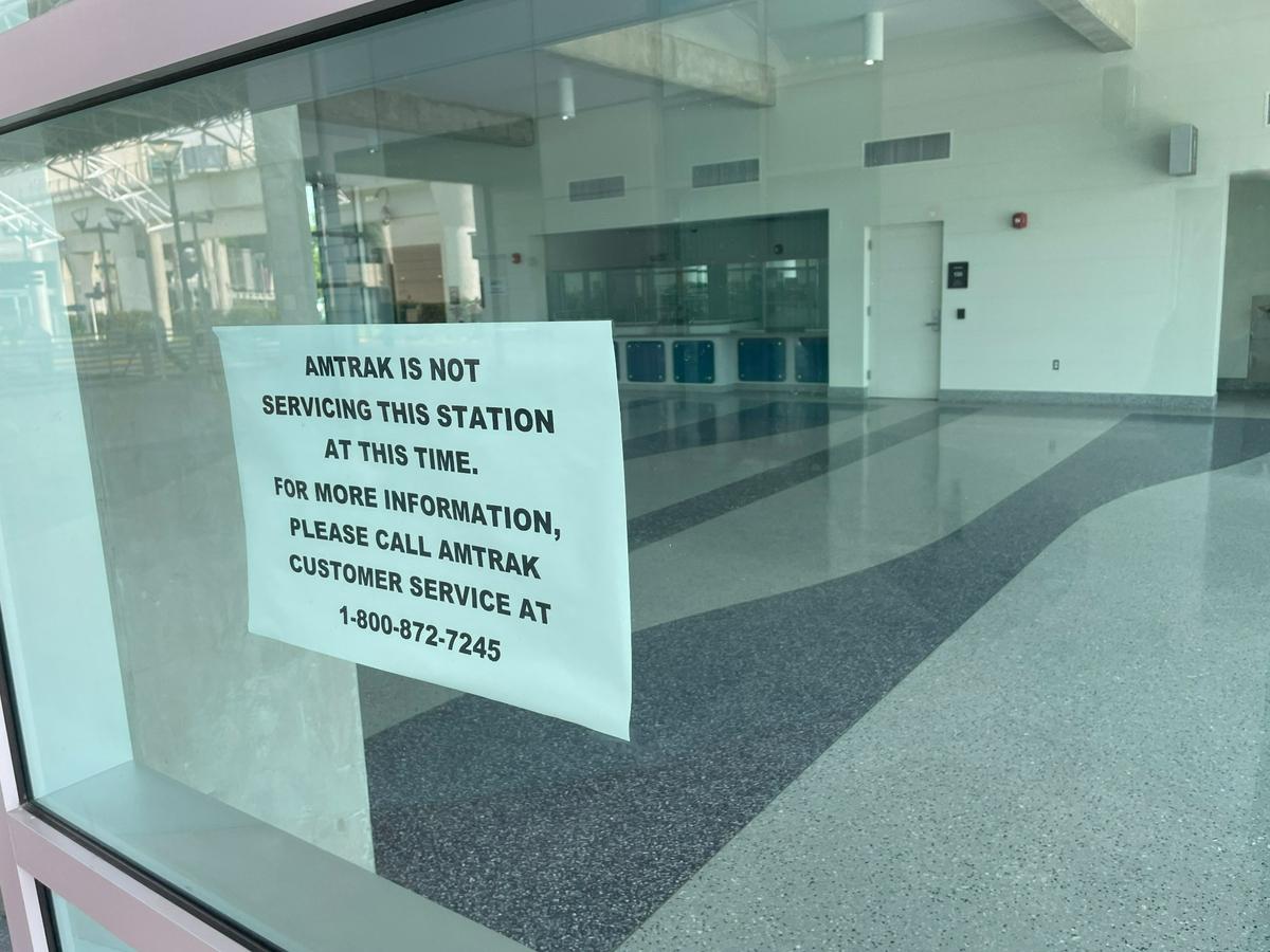 Miami International Airport’s transportation hub has an Amtrak station, but it has not been used since the place opened in 2015. A sign taped to the window tells visitors that, despite the branding on the building, there is no Amtrak service at MIA.