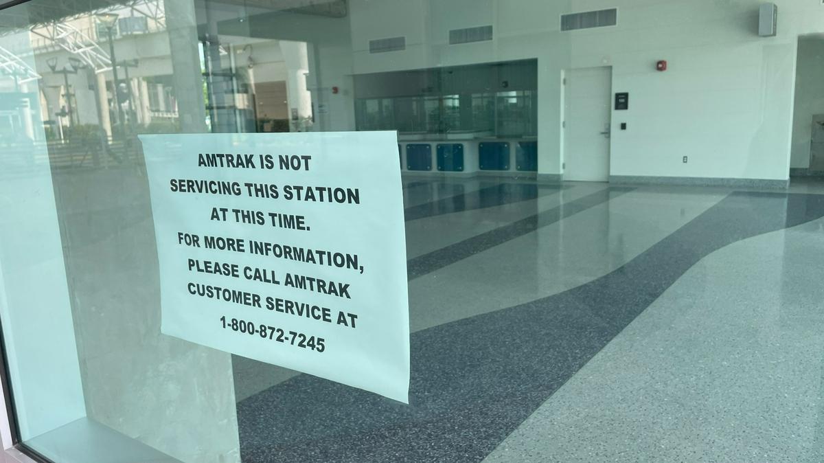 Miami International Airport’s transportation hub has an Amtrak station, but it has not been used since the place opened in 2015. A sign taped to the window tells visitors that, despite the branding on the building, there is no Amtrak service at MIA.