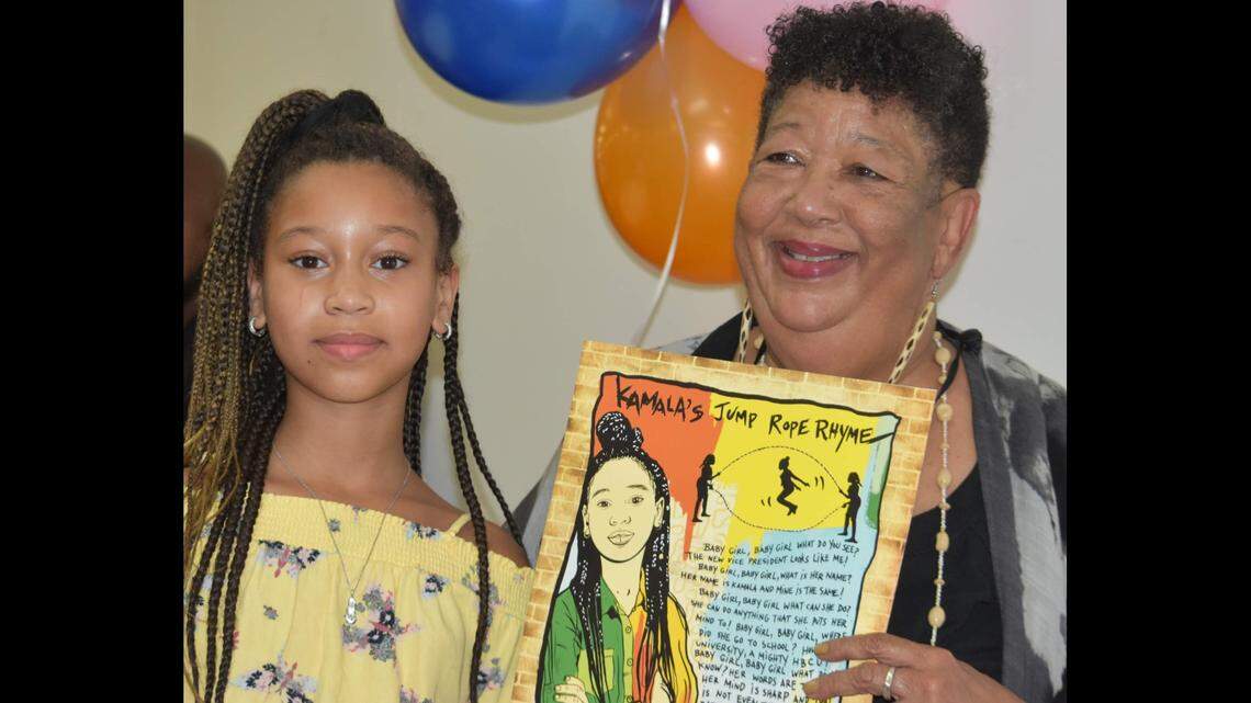 Femi Folami-Browne and Nataki Miller, who was the model for the “Kamala’s Jump Rope Rhyme” poster. The artist is Tee Davis, aka Tee Pop.