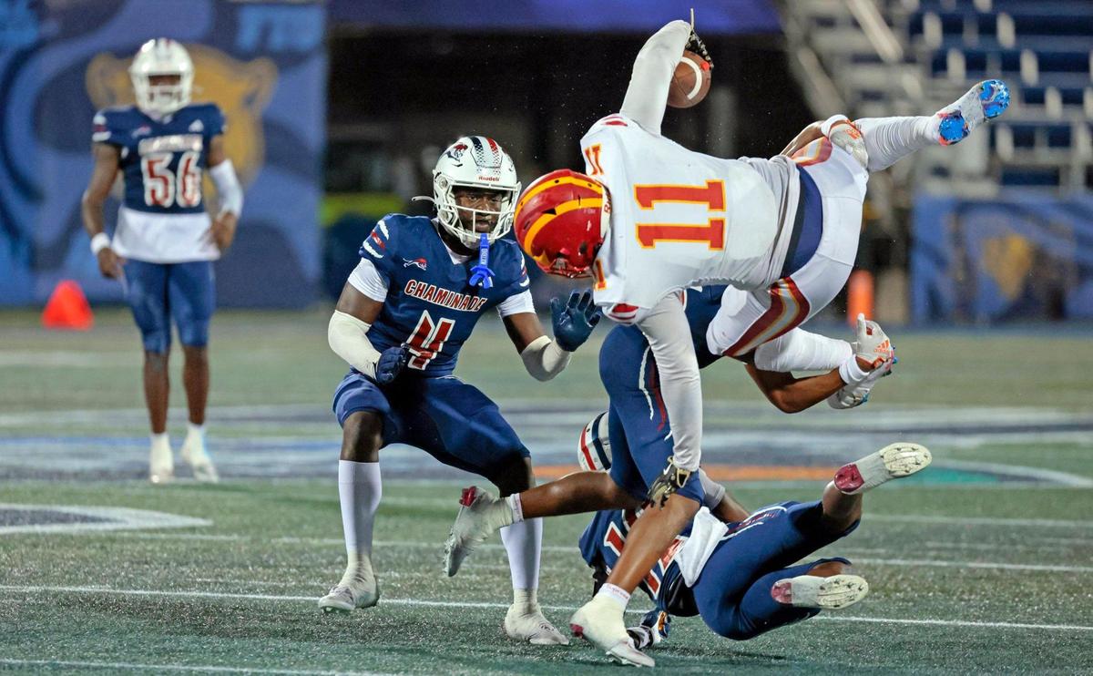 Chaminade-Madonna’s Angelo Smith (16) and Kelly Sejour Jr. (12) take down Clearwater Central Catholic’s Keo Jenkins (11) in the first half of the Florida High School Football State Championships - Class 1A game at Pitbull Stadium on the campus of Florida International University in Miami, Florida, on Wednesday, December 11, 2024.