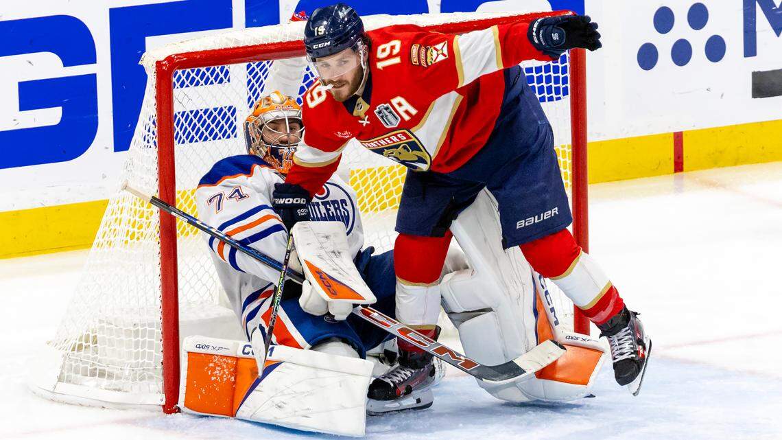 Edmonton Oilers goaltender Stuart Skinner (74) holds back Florida Panthers left wing Matthew Tkachuk (19) during the third period of Game 5 of the NHL Stanley Cup Final at the Amerant Bank Arena on Tuesday, June 18, 2024, in Sunrise, Fla.