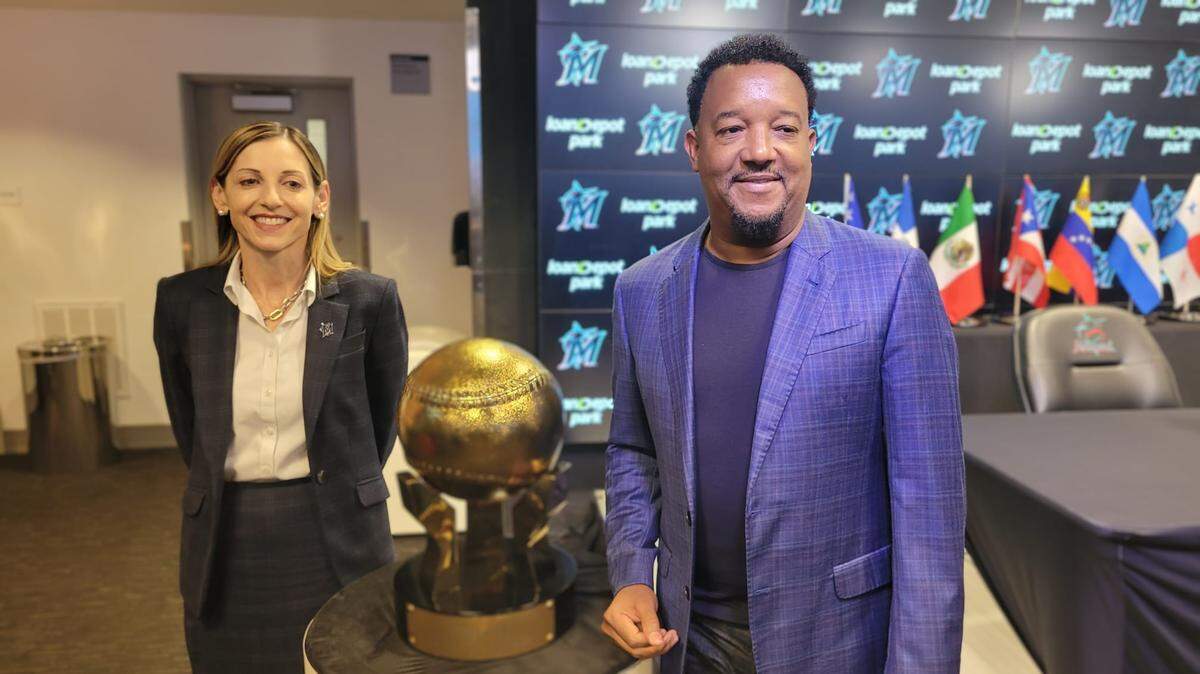 Miami Marlins president of business operations Caroline O’Connor and hall of famer Pedro Martinez stand with the trophy for the Serie Del Caribe on Thursday, Jan. 11, 2024, at loanDepot park in Miami, Florida.