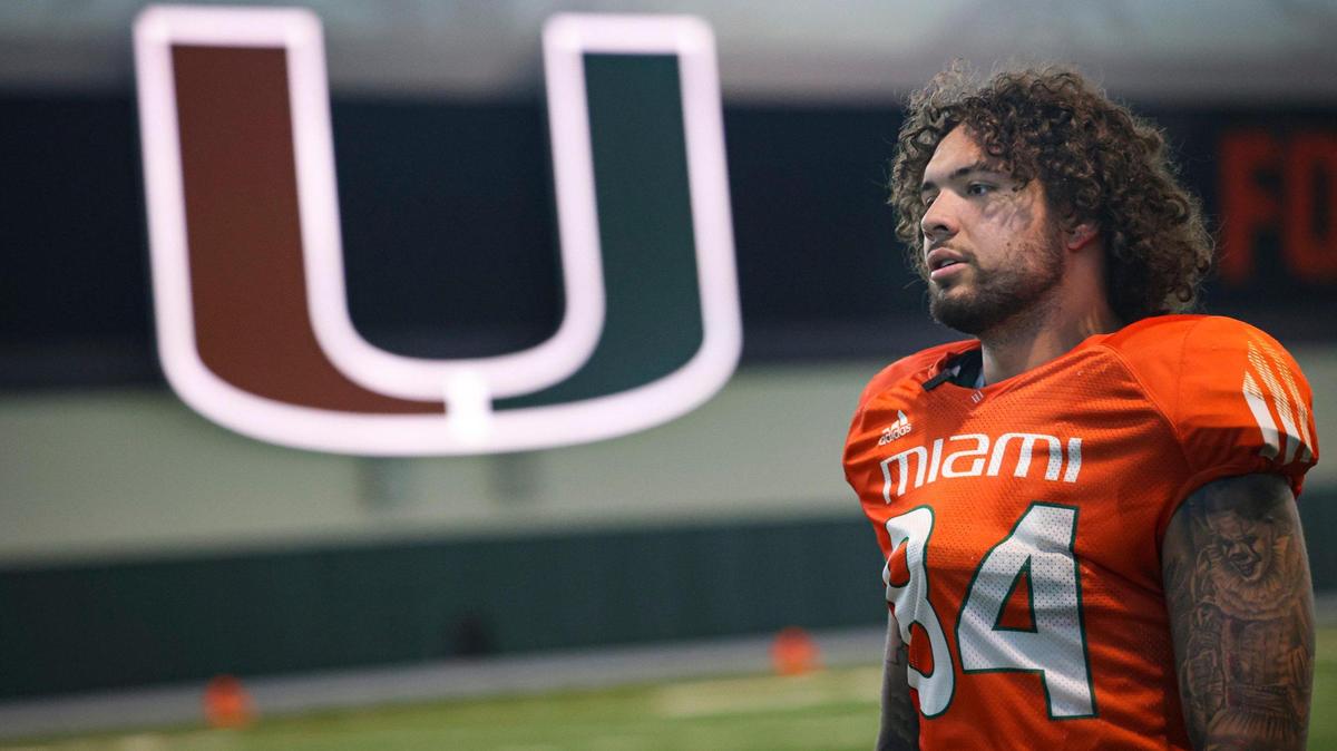 Hurricanes tight end Cam McCormick (84) walks over to talk to the press after the University of Miami Hurricanes football practice on Tuesday, March 21, 2023, on campus in Coral Gables. McCormick transferred to Miami from Oregon in January.