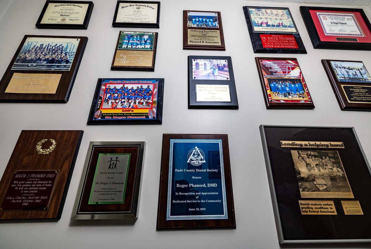 Accolades and diplomas hang on the wall recognizing the Phanord men at the offices of Phanord & Associates on Monday, June 9, 2025, in North Miami, Florida.