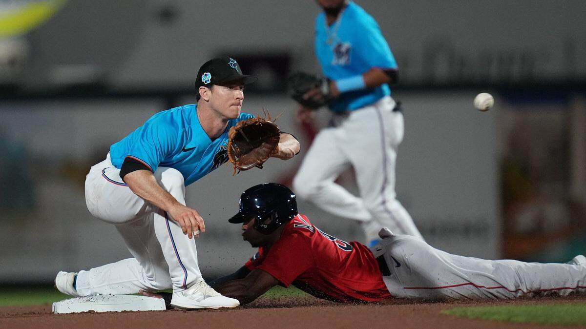Boston Red Sox left fielder Greg Allen (31) steals second base as Miami Marlins shortstop Joey Wendle (18) covers on the play in the first inning at Roger Dean Stadium on Feb 28, 2023 in Jupiter, Florida.
