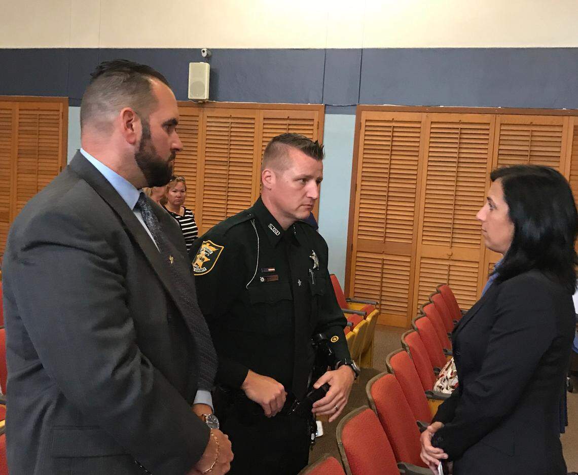 Monroe County Sheriff’s Office Sgt. David Lariz and St. John’s County Sheriff’s Office Deputy Joshua Gordon speak with Assistant State Attorney Colleen Dunne following the guilty verdict of Timothy Thomas on April 25, 2018, at the Plantation Key courthouse. Thomas shot Gordon in the chest when Gordon was a Monroe County Sheriff’s Office deputy. Dunne faces disciplinary action from the Florida Bar for reportedly withholding discovery evidence in a 2009 attempted murder case.