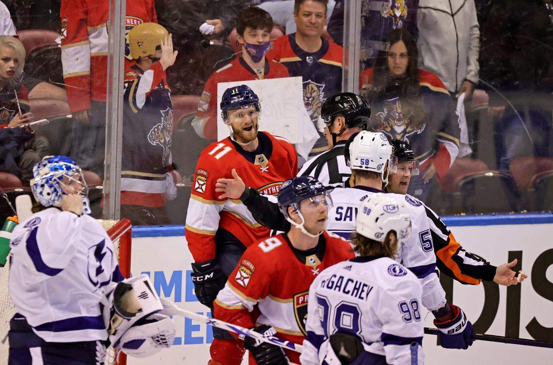 Florida Panthers left wing Jonathan Huberdeau (11) fights with Tampa Bay Lightning defenseman David Savard (58) during the third period of game 1 of their first round NHL Stanley Cup series at the BB&T Center on Sunday, May 16, 2021 in Sunrise, Fl.