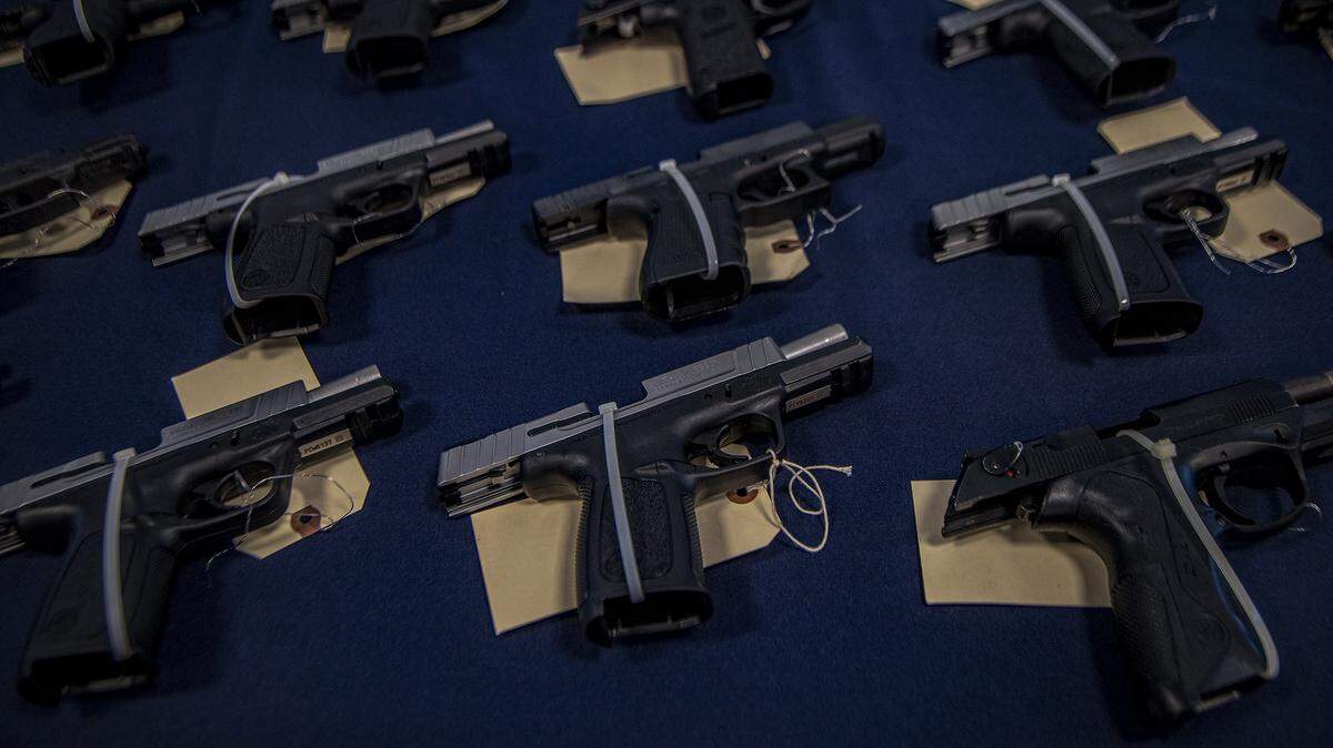 In this August 2022 file photo, several semiautomatic weapons are put on display as Homeland Security Investigations announce a crackdown on firearms and ammunition smuggling to Haiti and the Caribbean.