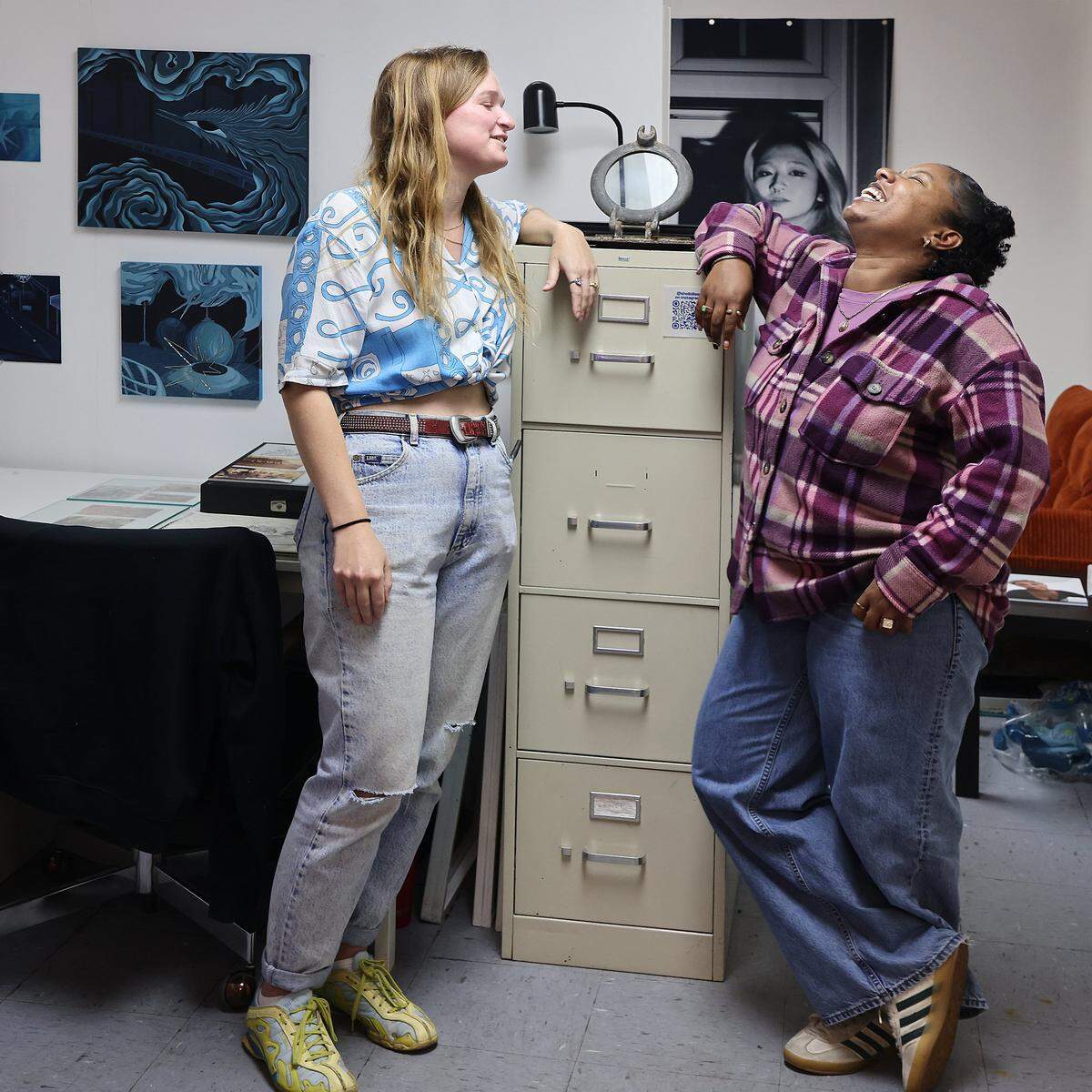 Resident artists Shelby Slayden, left, and Lauryn Lawrence talk in their studio at Tunnel Projects as ICA cohorts visit during a tour of the art space in Little Havana, Miami, Saturday, April 11, 2026.