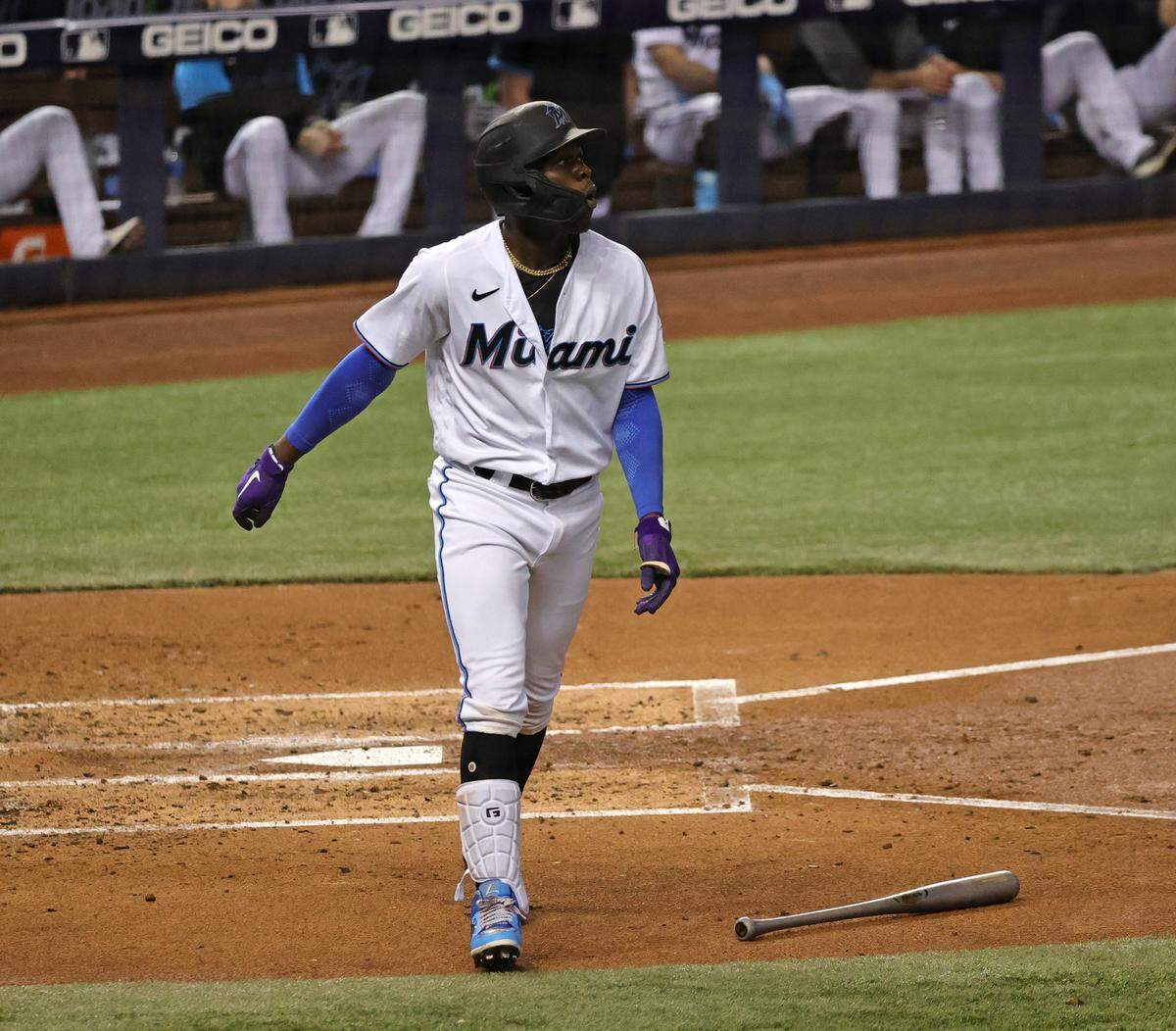 Miami Marlins shortstop Jazz Chisholm Jr. (2) follows through on a three run home run during the second inning of their baseball game against the Colorado Rockies at loanDepot park on Thursday, June 10, 2021 in Miami, Florida.