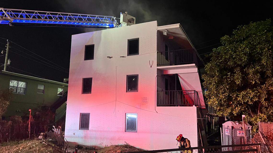 City of Miami firefighters work to put out flames at a building under renovation at 1348 NW First Avenue Monday night, March 3, 2025.