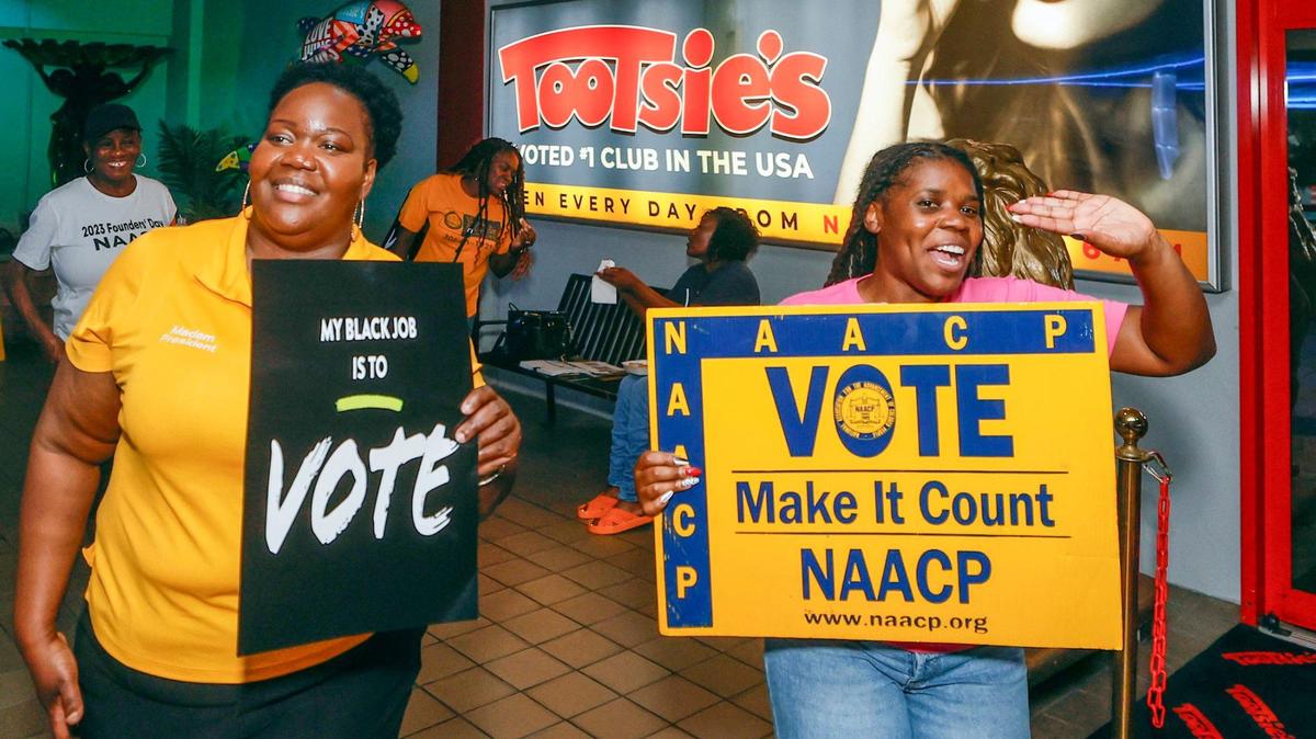 In an effort to register hard-to-reach voters, NAACP’s Miami-Dade Branch president Daniella Pierre, at left, and civic engagement committee member Monique Simon, at right, stand outside Tootsie’s Cabaret in Miami Gardens on Friday, October 4, 2024.