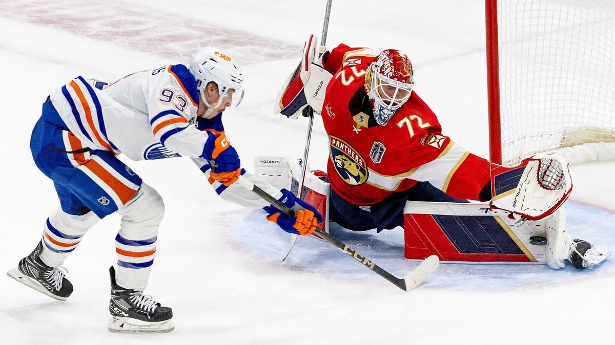 Florida Panthers goaltender Sergei Bobrovsky (72) blocks a shot from Edmonton Oilers center Ryan Nugent-Hopkins (93) during the first period of Game 1 of the NHL Stanley Cup Final at the Amerant Bank Arena on Saturday, June 8, 2024, in Sunrise, Fla.