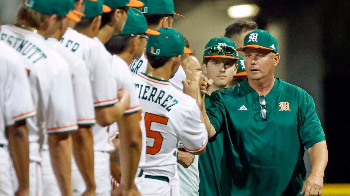 Miami Hurricanes coach Gino DiMare greets the team before the start of the game against Penn State at Mark Light Field at Alex Rodriguez Park in Coral Gables, Florida on Friday, February 17, 2023.