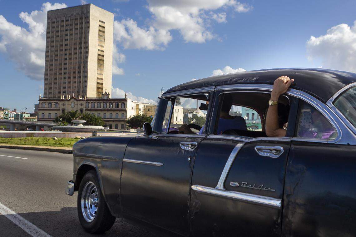 A vintage Bel Air heads toward the Hermanos Ameijeiras Hospital in Havana.