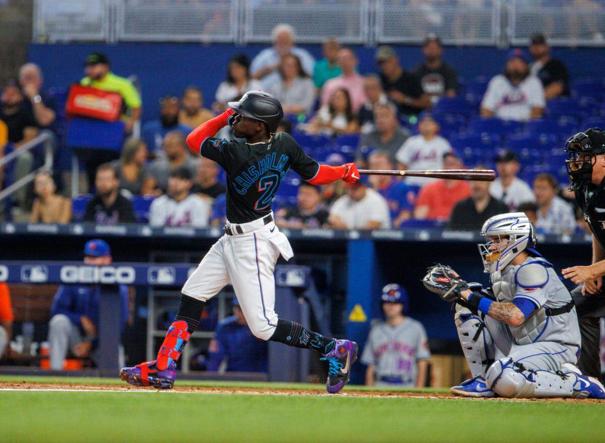 Miami Marlins second baseman Jazz Chisholm Jr. (2) hits a single during the first inning of a baseball game against the New York Mets at LoanDepot Park on Friday, June 24, 2022 in Miami, Florida.