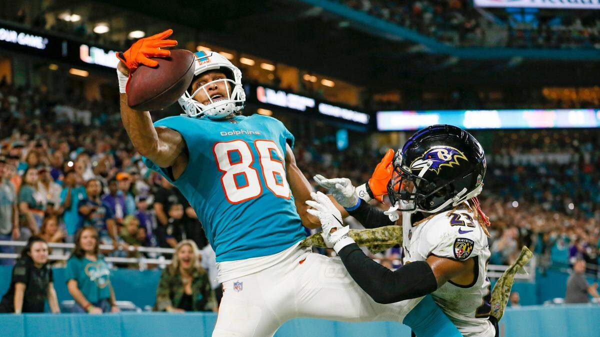 Miami Dolphins wide receiver Mack Hollins (86) drops a pass against the defense from Baltimore Ravens cornerback Anthony Averett (23) during the fourth quarter of an NFL football game at Hard Rock Stadium on Thursday, November 11, 2021 in Miami Gardens, Florida.