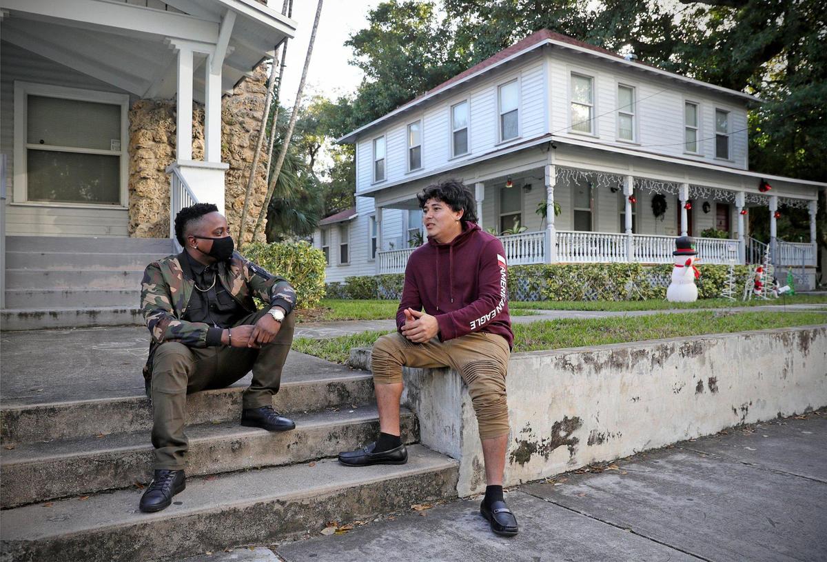 Marlon Williams, a program coordinator and life skills coach in the Casa Valentina program in Miami, mentors Nelson Ramos, who came from Honduras to the U.S. for a better education and is studying to become a mechanic.