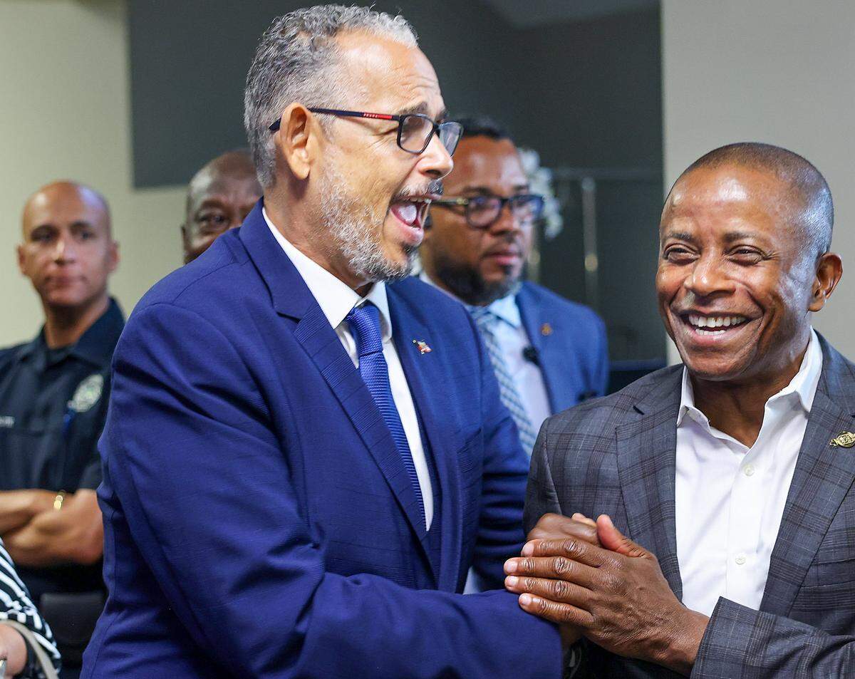 Haitian Prime Minister Alix Didier Fils-Aimé, left, is greeted by former North Miami mayor Andre D. Pierre, right, while arriving to the official launch of  the new Haitian Consulate in Miami at Roz and Cal Kovens Center in North Miami, Florida on May 6, 2026.