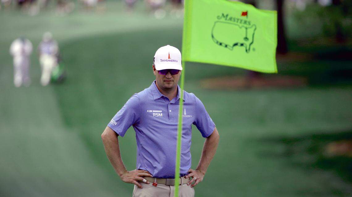 Zach Johnson looks at the green on the seventh hole during a practice round for the Masters golf tournament Monday, April 8, 2019, in Augusta, Ga.