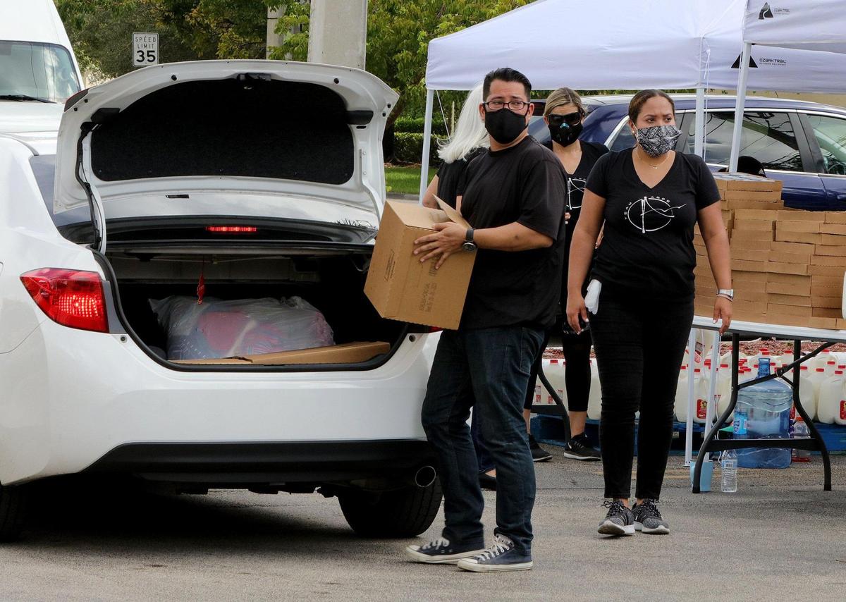 Volunteers from the Arde Church helped during a food drive sponsored by the Venezuelan Embassy in the U.S. in partnership with Feeding South Florida and the Venezuelan Diaspora. The groups provided groceries to 300 families in Doral, on Saturday, Aug. 22, 2020.