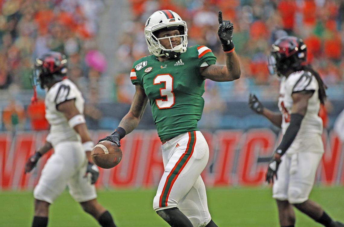 Miami Hurricanes wide receiver Mike Harley (3) signals a first down after a pass reception in the first quarter as the University of Miami Hurricanes host the Louisville Cardinals on Saturday, November 9, 2019.