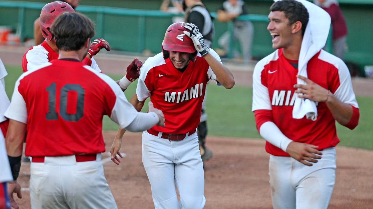 Miami Christian’s Marcos Alvero (11) is greeted by teammates after hitting a second inning home run as they play Real Life Christian in the FHSAA Baseball Class 2A state semifinal at CenturyLink Sports Complex - Hammond Stadium in Fort Myers, Florida, Wednesday, May, 22, 2019.