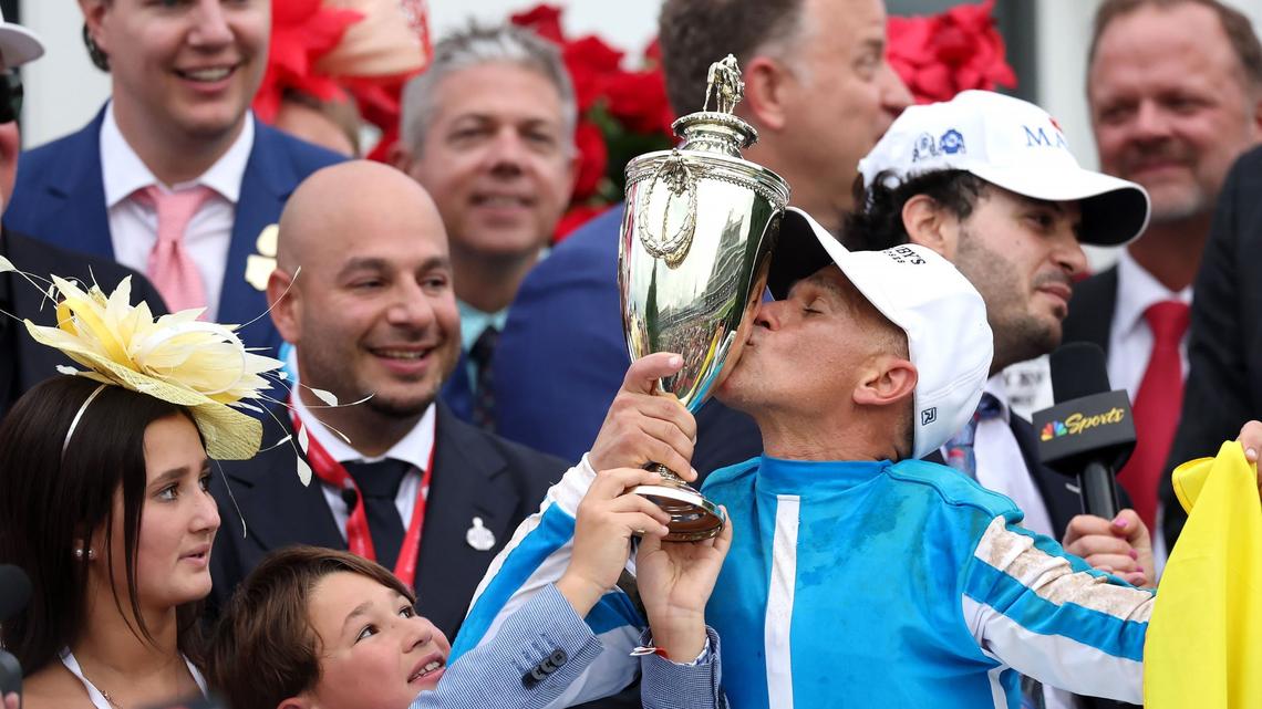 Core owner Ramiro Restrepo, left, smiles as jockey Javier Castellano celebrates in the winner’s circle after guiding Mage to victory in the 149th running of the Kentucky Derby at Churchill Downs on Saturday, May 6, 2023, in Louisville, Kentucky. (Rob Carr/Getty Images/TNS)