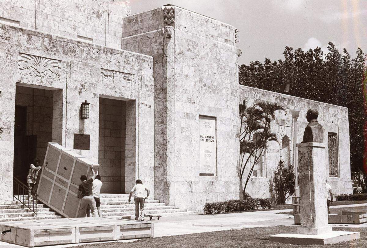 Workers drag a large artwork through the front door of The Bass Museum in 1989. The Art Deco building presented a challenge for curators because it didn’t have spaces to display large artworks.