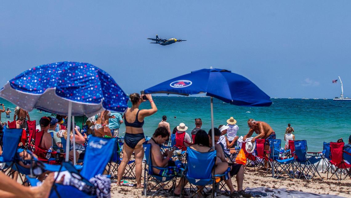 Beach goers look to a A C-130 HERCULES “FAT ALBERT” with the U.S. Navy Blue Angels flying over the during the 2023 Fort Lauderdale Air Show. on Saturday April 29, 2023.